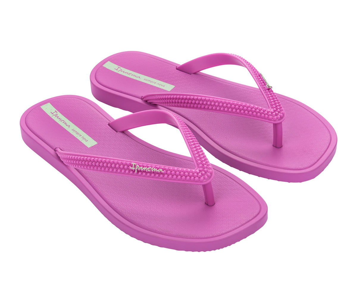 Angled view of a pair of purple Ipanema Solar flip flops.