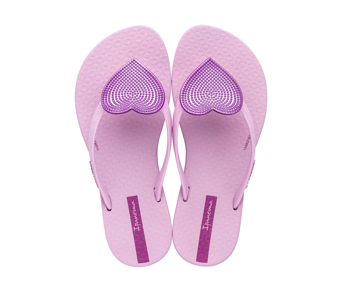 Top view of a pair of pink Ipanema Wave Heart kids flip flops with a metallic pink heart on top.